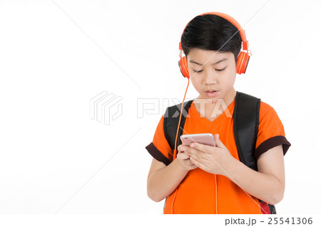Happy asian boy using cell phone . Happy asian boy using cell phone . 25541306