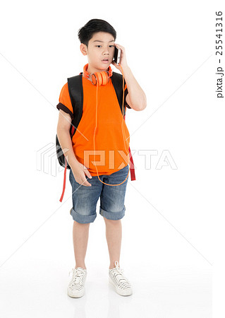 Happy asian boy using cell phone . Happy asian boy using cell phone . 25541316