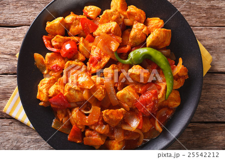Spicy chicken jalfrezi with pepper and onion Spicy chicken jalfrezi with pepper and onion 25542212