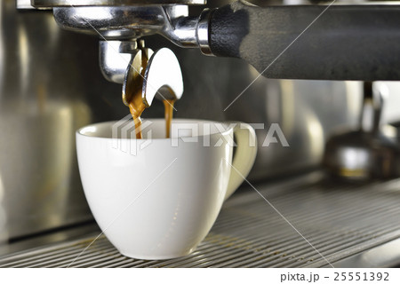 Coffee machine making coffee in a coffee shop Coffee machine making coffee in a coffee shop 25551392