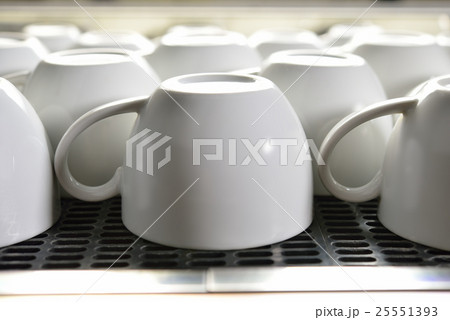 Close-up empty coffee cup on coffee machine 25551393