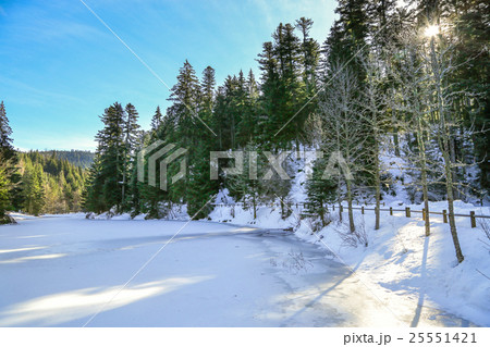 frozen Longemer lake in the Vosges Mountain 25551421