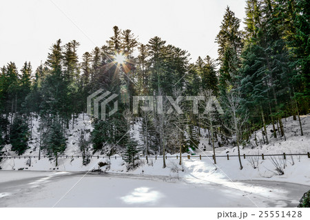 frozen Longemer lake in the Vosges Mountain frozen Longemer lake in the Vosges Mountain 25551428