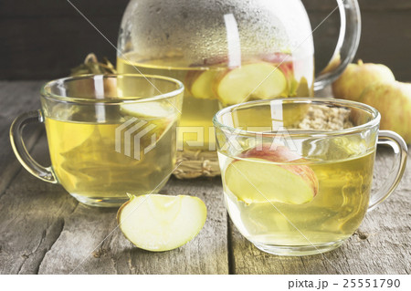 Apple tea on a dark wooden background. Toning 25551790