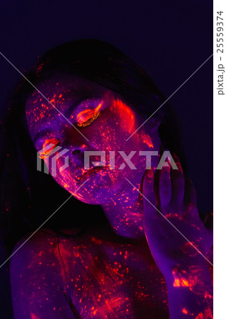 Portrait of beautiful girl with ultraviolet paint on her face. G Portrait of beautiful girl with ultraviolet paint on her face. G 25559374