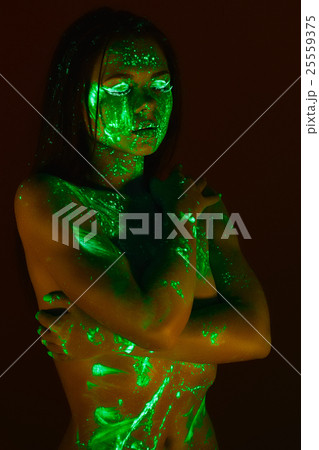 Portrait of beautiful girl with ultraviolet paint on her face. G Portrait of beautiful girl with ultraviolet paint on her face. G 25559375