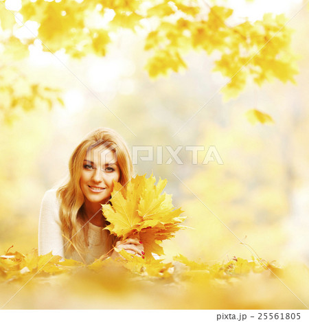 Woman laying in autumn park Woman laying in autumn park 25561805