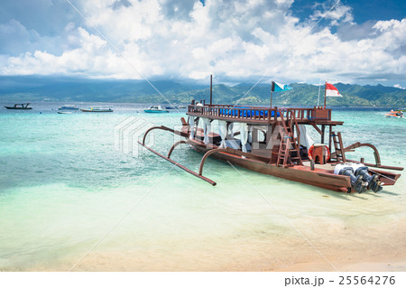 Catamaran as excursion boat at tropical beach Catamaran as excursion boat at tropical beach 25564276