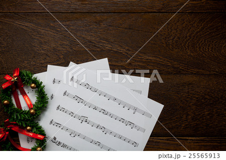 Christmas music note paper with Christmas wreath. Christmas music note paper with Christmas wreath. 25565913