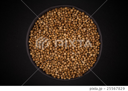 Coriander seeds in  small bowl 25567829