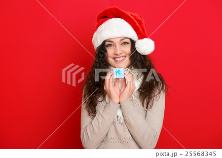 girl in santa hat portrait, christmas holiday 25568345