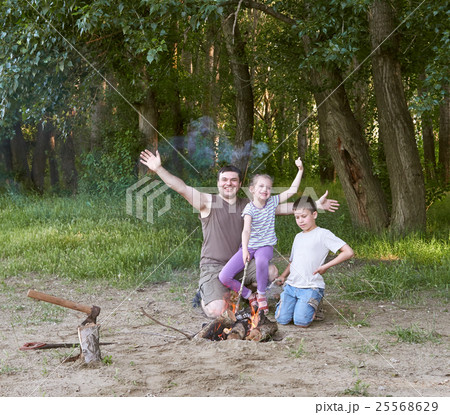 people camping in forest, family active in nature 25568629