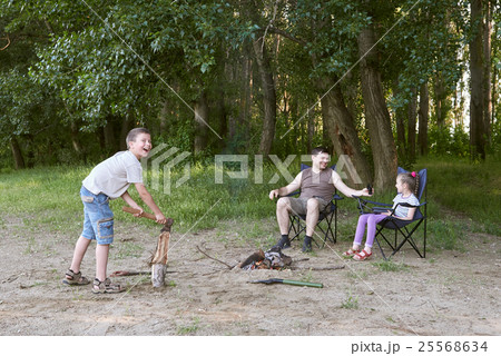 people camping in forest, family active in nature 25568634
