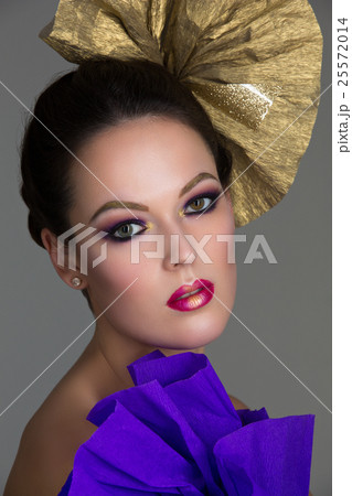 Brunette girl with purple make-up Brunette girl with purple make-up 25572014
