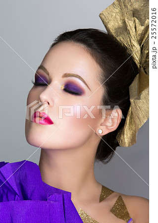 Brunette girl with purple make-up Brunette girl with purple make-up 25572016