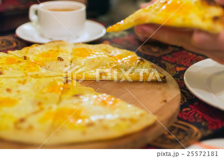 Cheese pizza on wooden cutting board Cheese pizza on wooden cutting board 25572181