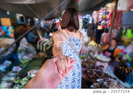 Young couple in Maeklong railway market Young couple in Maeklong railway market 25577154