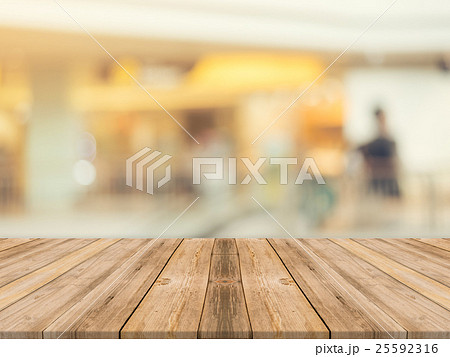 Wooden board empty table blur in department store 25592316