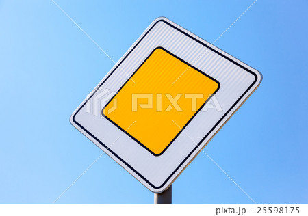 Traffic signs main road against the blue sky   25598175