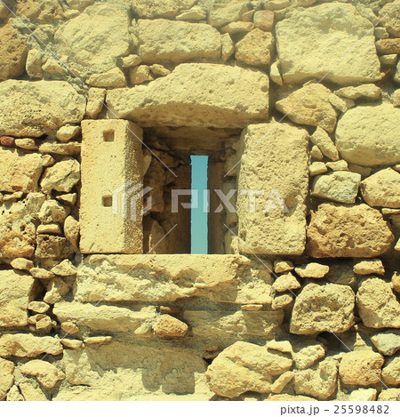 Window in old stone wall ruins 25598482