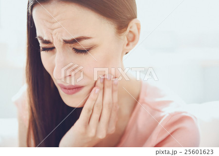 Close up of young unhappy woman which having 25601623