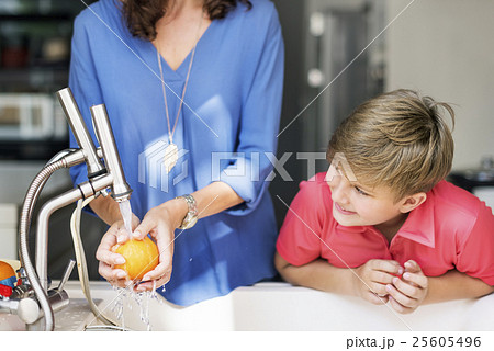 Mom Son Washing Fruits Togetherness Cheerful Concept 25605496