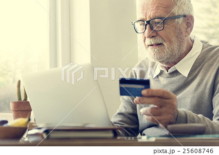 Senior Adult Holding Credit Card Concept Senior Adult Holding Credit Card Concept 25608746