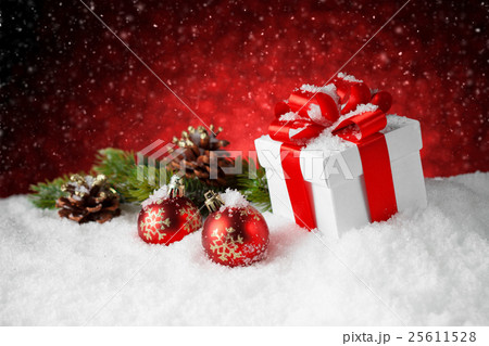 Christmas gift box and decoration on snow Christmas gift box and decoration on snow 25611528