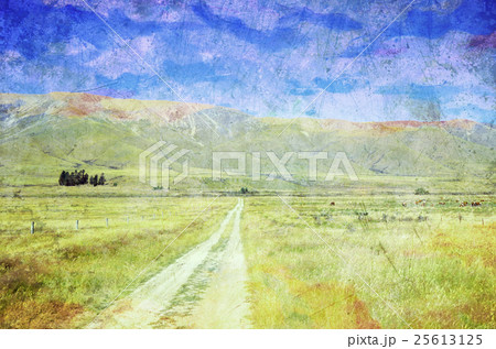 Grunge textured country road through meadows Grunge textured country road through meadows 25613125