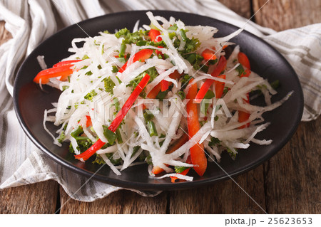 Tasty salad of daikon with pepper and herbs Tasty salad of daikon with pepper and herbs 25623653