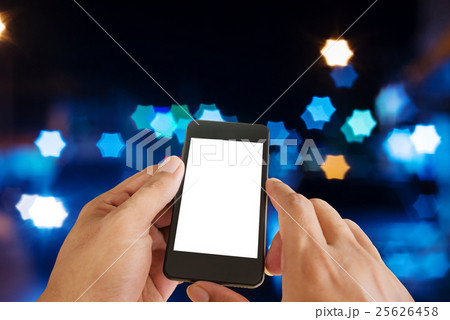 Hand man with smart phone mobile on night city 25626458