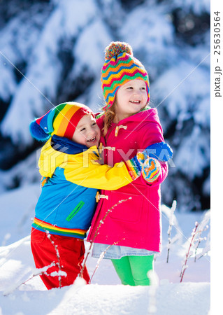 Children playing in snowy winter park Children playing in snowy winter park 25630564