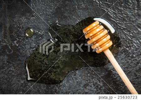 Honey dipper closeup Honey dipper closeup 25630723