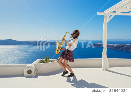 Girl,  saxophone and  sea 25644324
