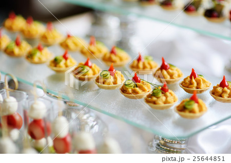 Plates with assorted snacks on an event party 25644851