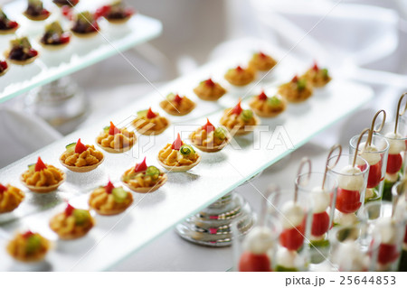Plates with assorted snacks on an event party 25644853