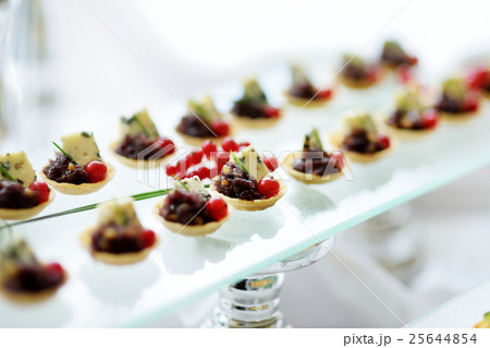 Plates with assorted snacks on an event party 25644854