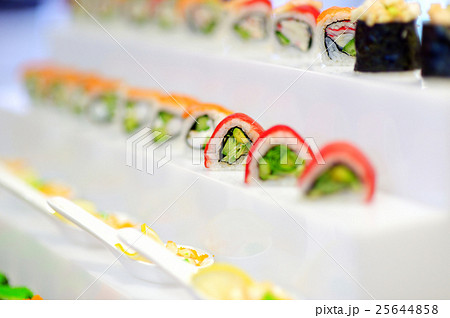 Delicious sushi arranged in a row on a tray 25644858