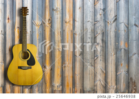 Acoustic guitar on wooden background texture 25646938