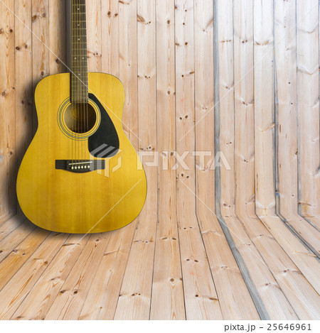 Acoustic guitar on wooden background texture 25646961