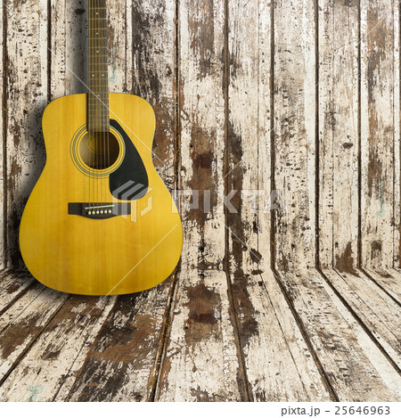 Acoustic guitar on wooden background texture 25646963