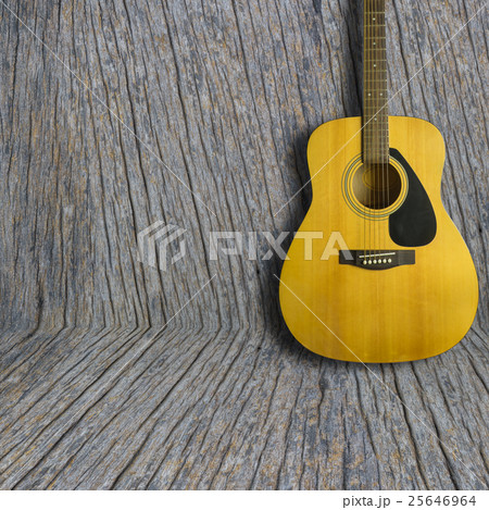 Acoustic guitar on wooden background texture 25646964