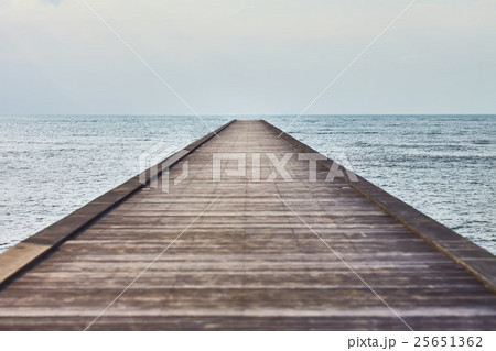 Perspective view of a wooden pier in tropical sea 25651362