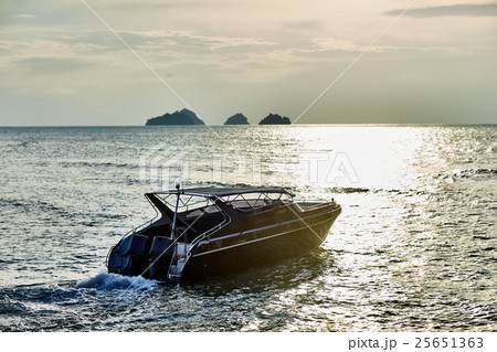 Boat on sunset in the sea 25651363