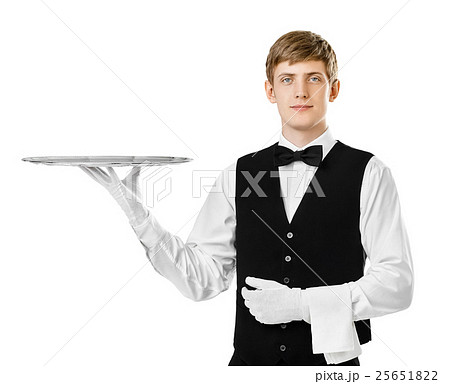 Young Handsome Waiter Holding Empty Trayの写真素材