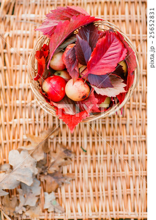 Juicy apples on a wicker tray, surrounded by 25652831