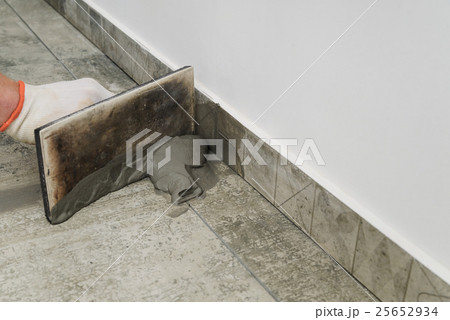 Grouting ceramic tiles. Grouting ceramic tiles. 25652934