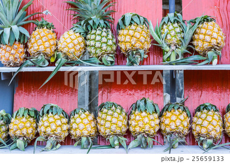 pineapple on wooden stall pineapple on wooden stall 25659133