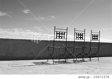 Rusty chair on a balcony Rusty chair on a balcony 25671379