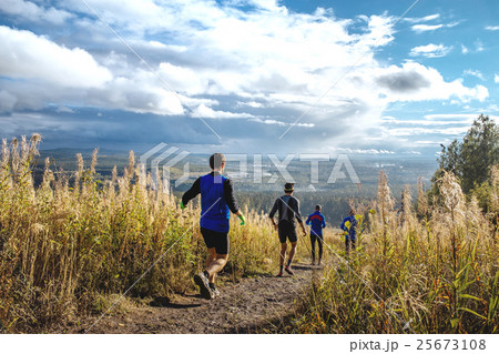 group of runners running mountain trail group of runners running mountain trail 25673108